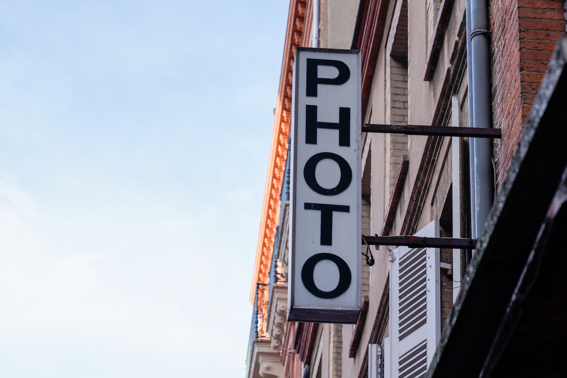 photo sign text front of store photograph picture shot agency shop of camera